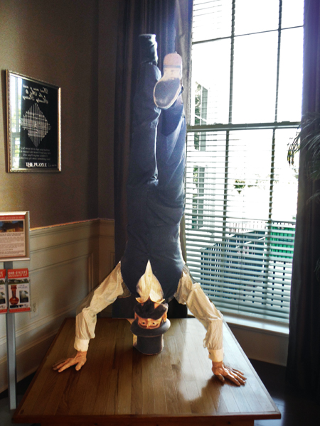 upside-down man on a table